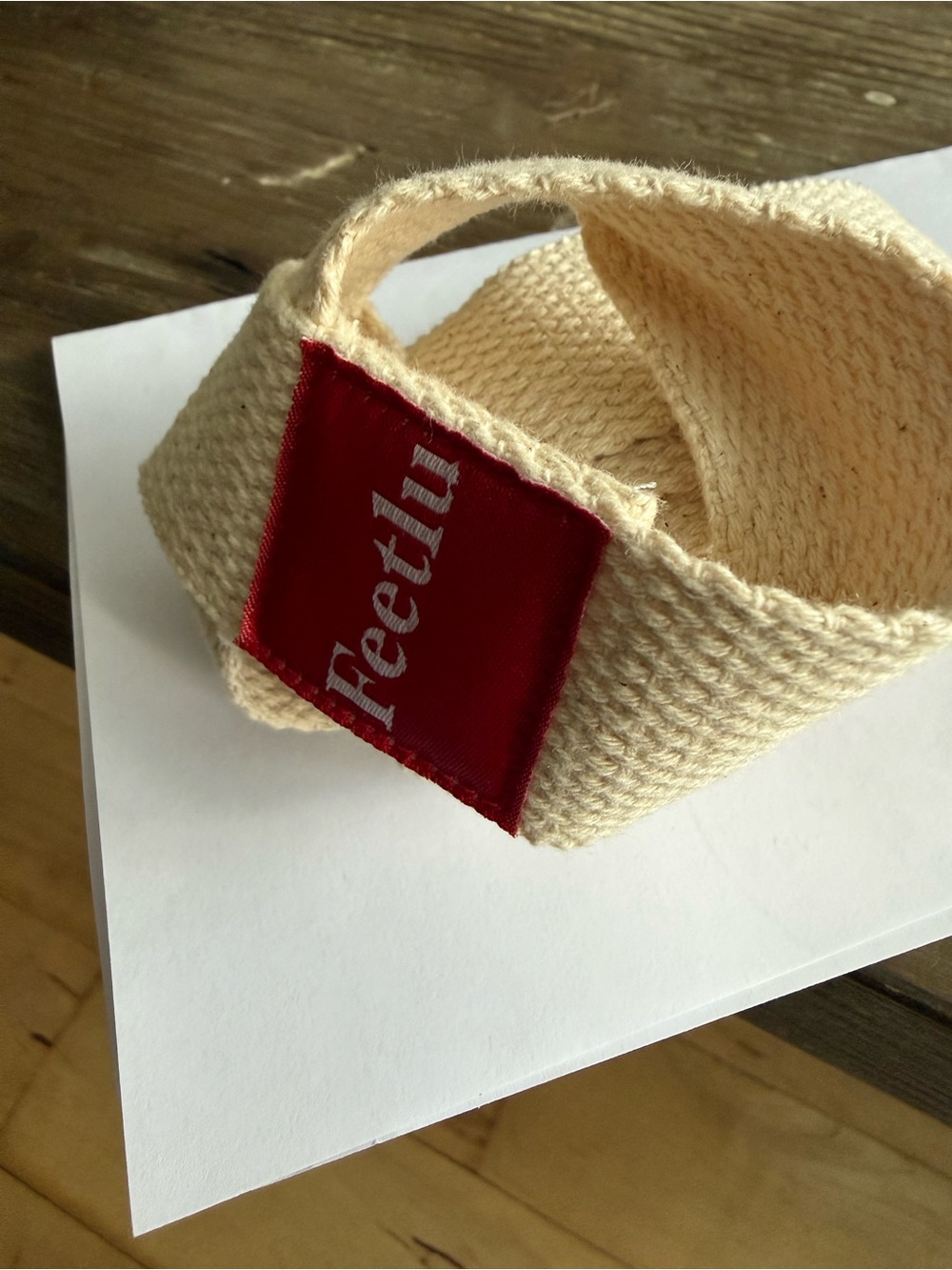 Cream Woven Hair Wrap with Red Logo Patch